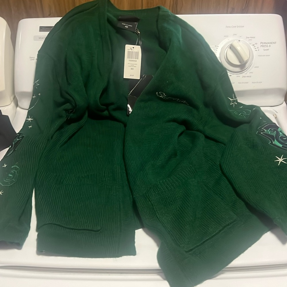 harry potter sweater new with tags dark greenn with designs down the sleeves